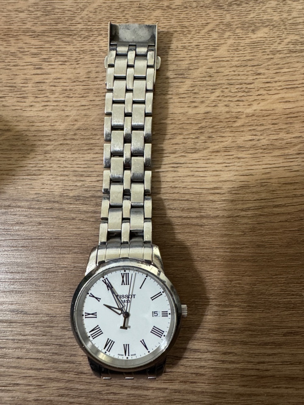 Tissot Silver Watch with White Dial and Roman Numerals